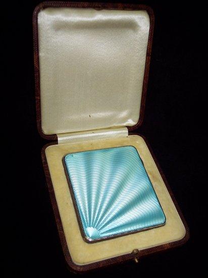 Appraisal: A cigarette case the cover decorated in pale blue guilloche