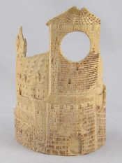 Appraisal: A carved ivory watchstand carved as a continental castle the