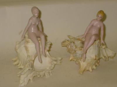 Appraisal: A pair of bisque bathing belles modelled nude with moulded