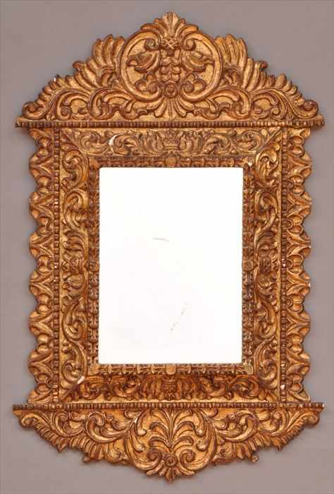 Appraisal: SPANISH BAROQUE-STYLE CARVED GILTWOOD WALL MIRROR The shaped crest decorated