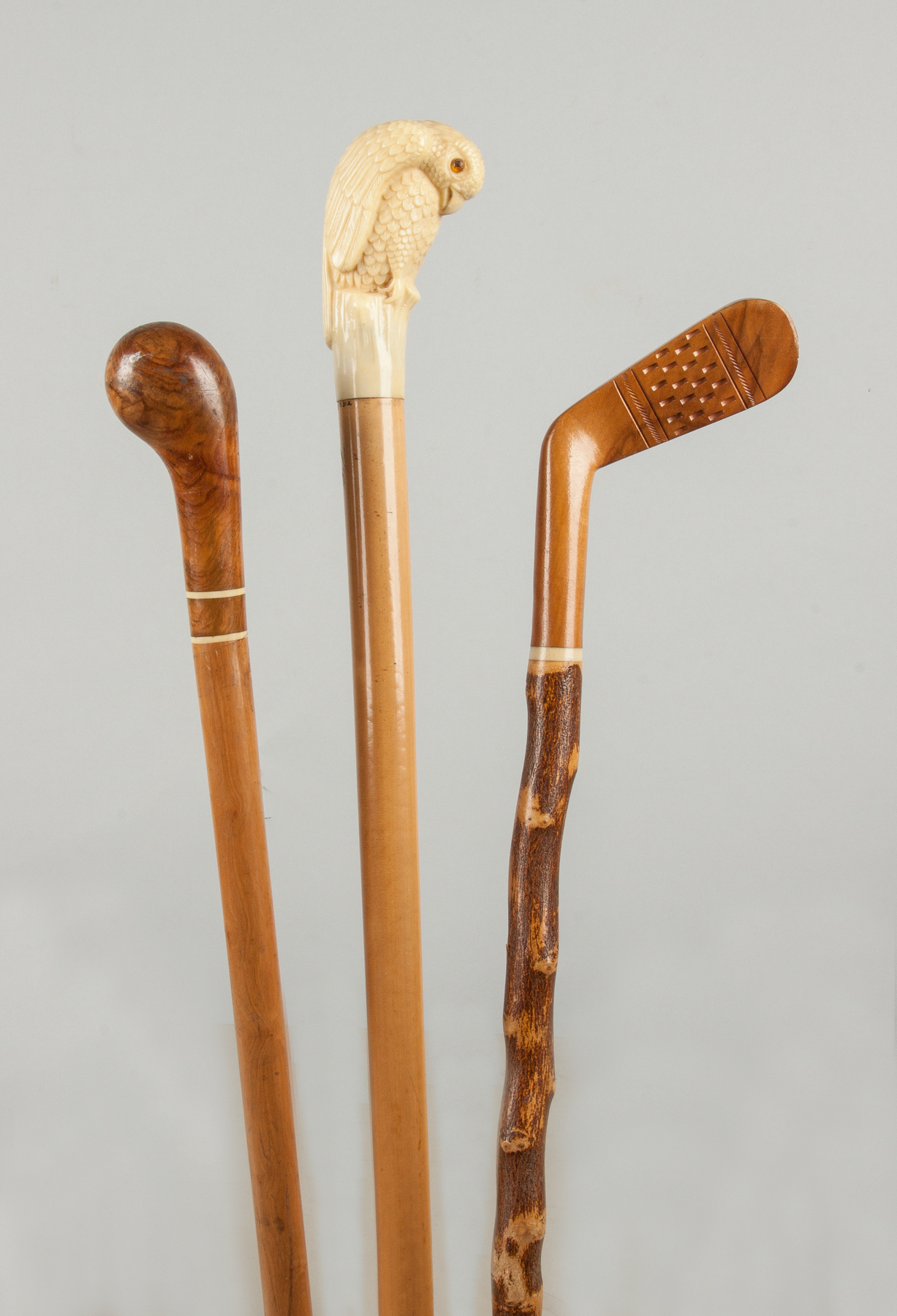 Appraisal: Three Wood Canes with Carved Handles Late th early th