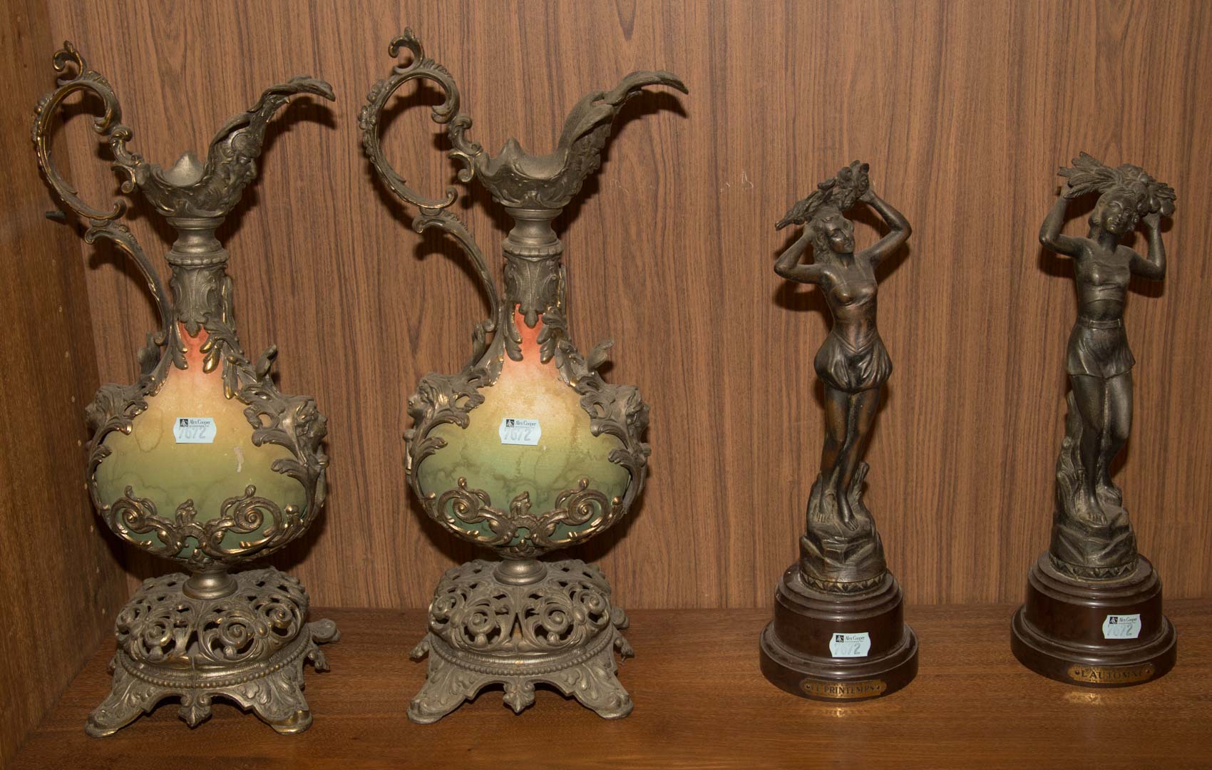 Appraisal: Two metal figures a pair of metal-mounted ewers