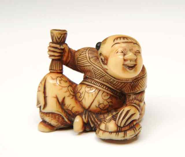 Appraisal: A CHINESE IVORY NETSUKE in the form of a Karako