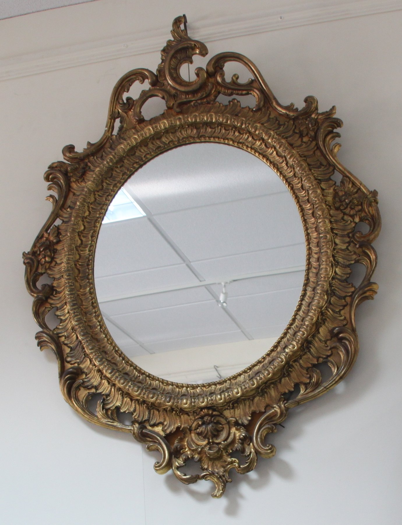 Appraisal: A pair of oval gilt wood wall mirrors of rococo