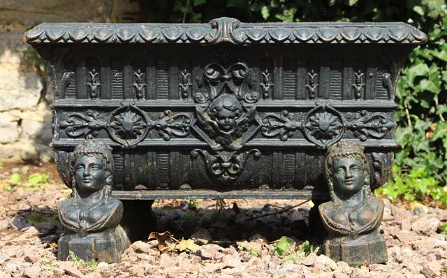 Appraisal: A CAST IRON RECTANGULAR PLANTER on supports moulded in the