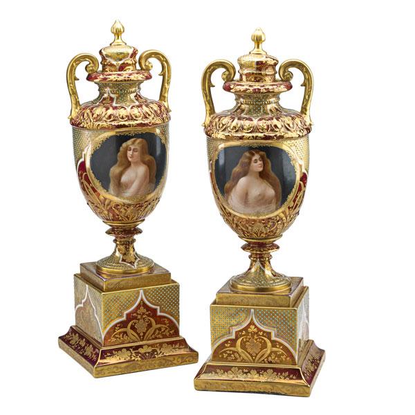 Appraisal: PAIR OF VIENNA COVERED URNS Gilt decorated and jeweled porcelain