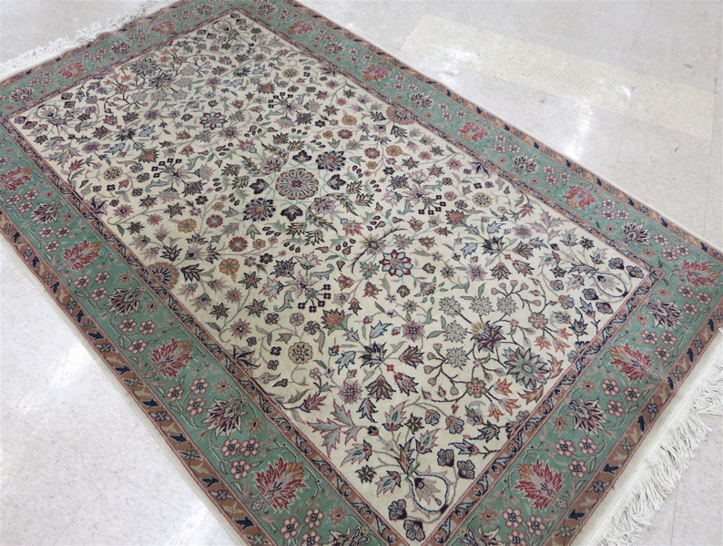 Appraisal: HAND KNOTTED ORIENTAL AREA RUG Pakistani-Persian overall floral design on