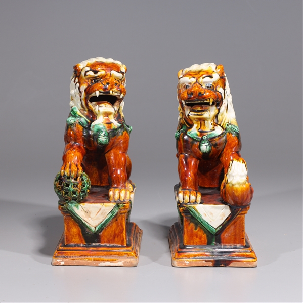 Appraisal: Pair of Chinese sancai glazed ceramic foo lions H x