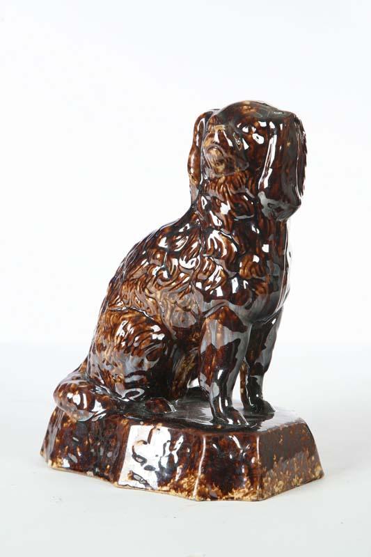 Appraisal: ROCKINGHAM DOG Seated dog of typical form with a brown