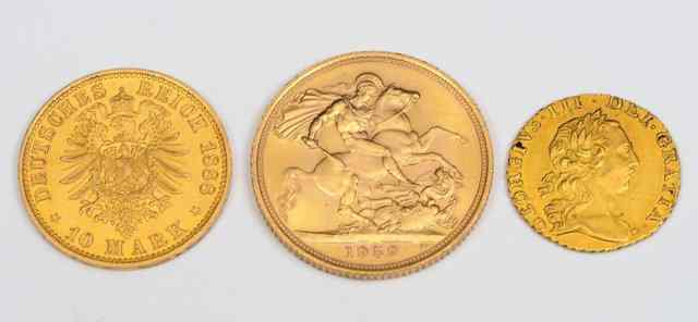 Appraisal: A GOLD SOVEREIGN a quarter guinea and a German Mark