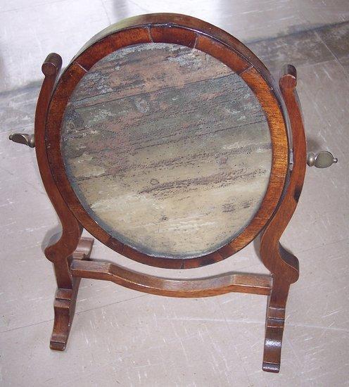 Appraisal: A George III style oval swing frame mirror cm high