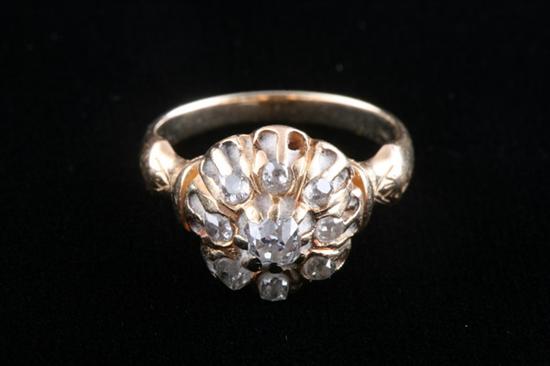 Appraisal: VICTORIAN K YELLOW GOLD AND DIAMOND CLUSTER RING Cushion-cut diamond