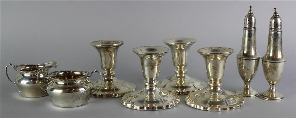 Appraisal: EIGHT PIECES OF AMERICAN SILVER SHORT CANDLESTICKS CREAM SUGAR PAIR