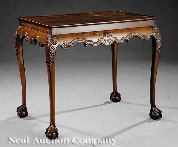 Appraisal: A George III-Style Carved Mahogany Silver Table tray top scalloped