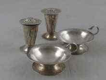 Appraisal: A matching pair of hand raised Arts and Crafts silver