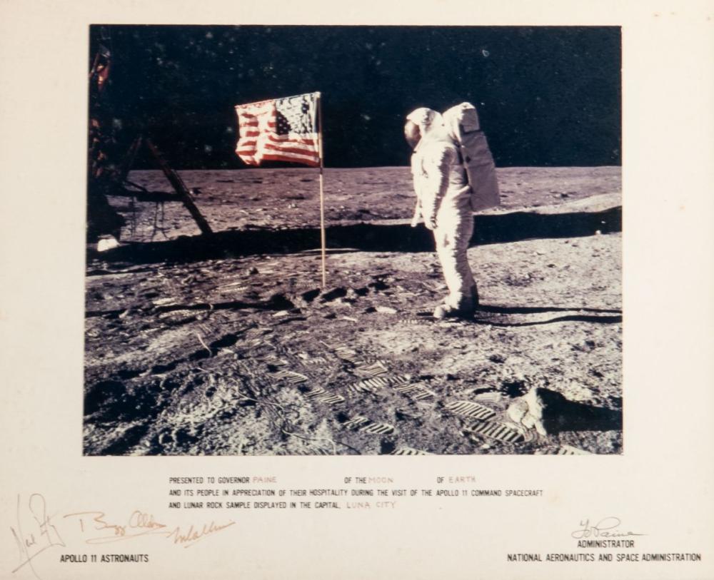 Appraisal: MAN ON MOONsigned by Apollos astronauts Neil Armstrong Buzz Aldrin