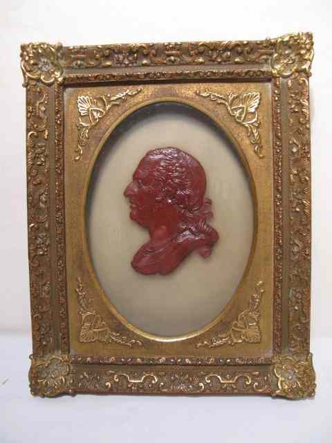 Appraisal: Red brown wax portrait of a gentleman on lightly frosted