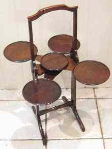 Appraisal: 'The Monoplane'' an unusual mahogany folding cake stand with five