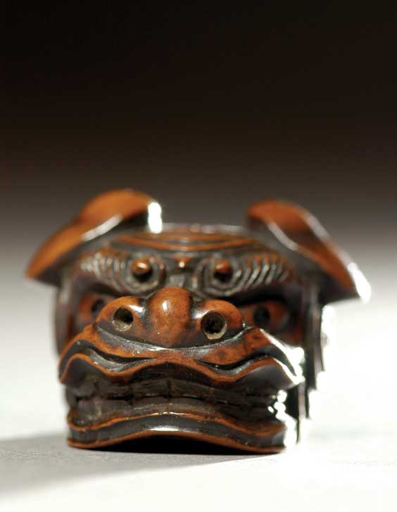 Appraisal: ANTIQUE WOOD NETSUKE Well carved antique wood netsuke of a