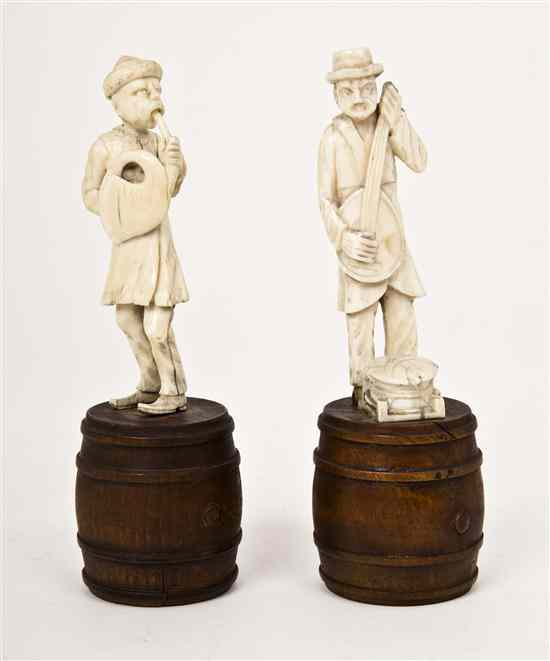 Appraisal: Two European Carved Ivory Figures of Musicians depicting a horn