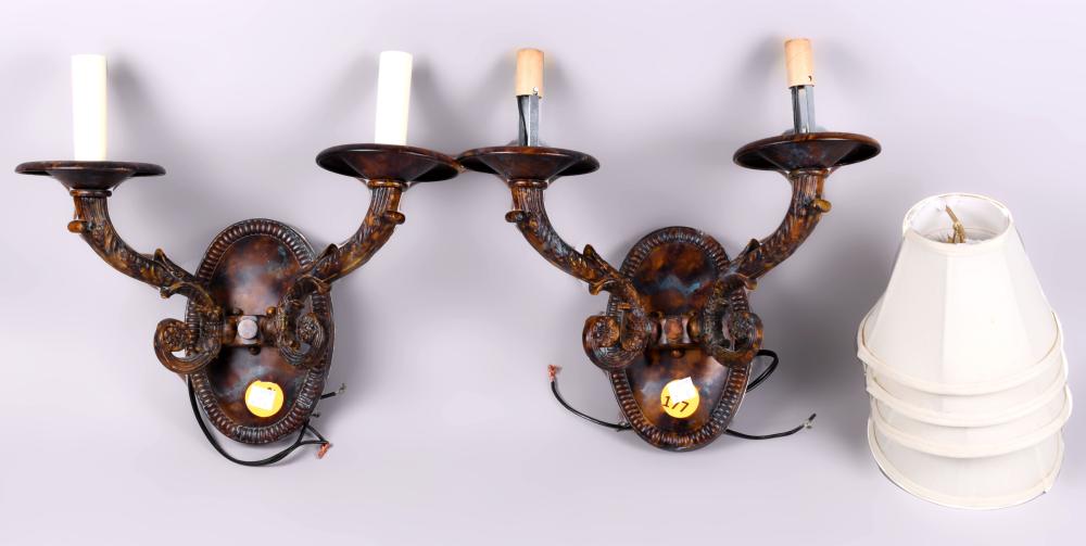 Appraisal: PAIR OF TWO-LIGHT METAL SCONCES with a patinated finish and