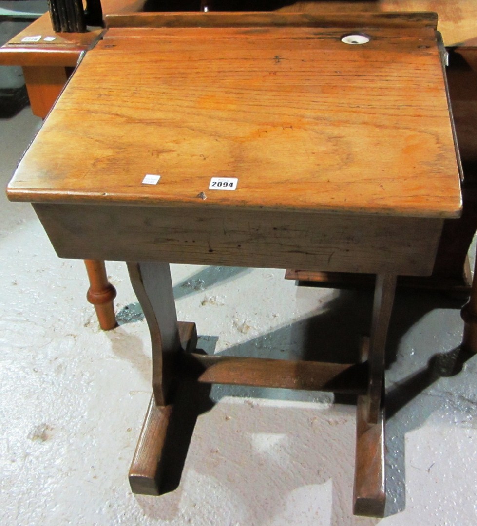 Appraisal: An oak lift top school desk