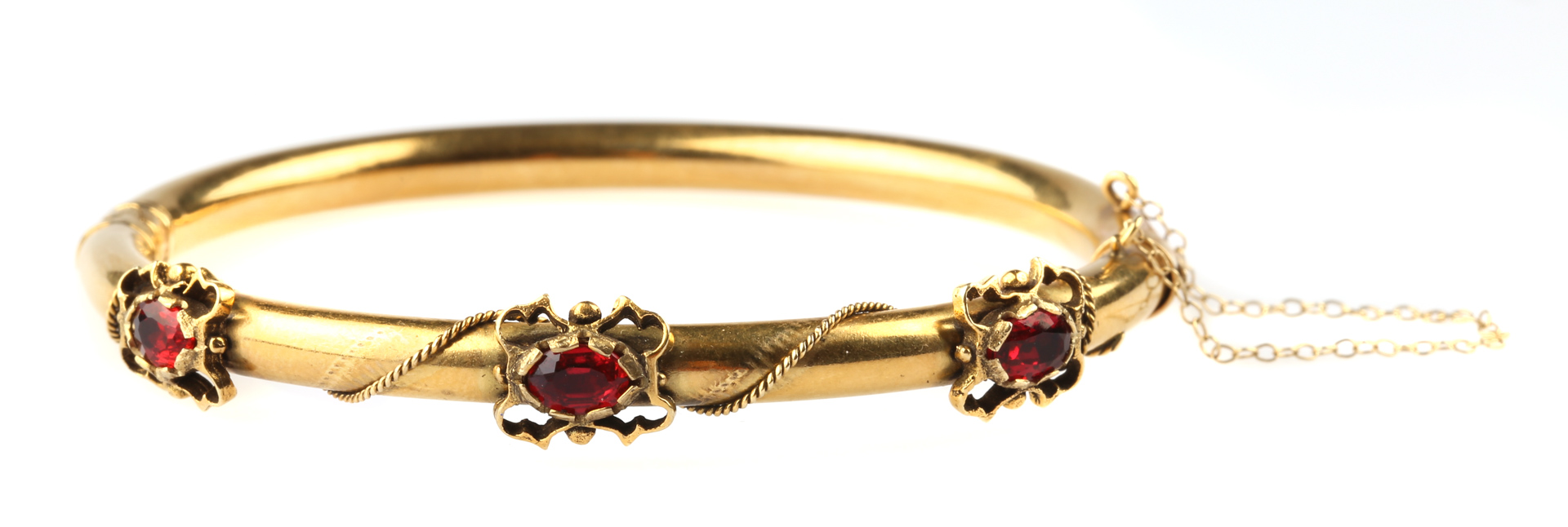 Appraisal: A Victorian Garnet Bangle Bracelet K bracelet with faceted garnets