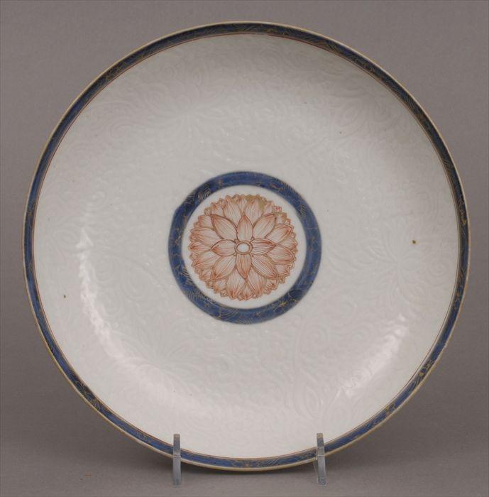 Appraisal: CHINESE INCISED PORCELAIN FOOTED DISH With iron red chrysanthemum rondel