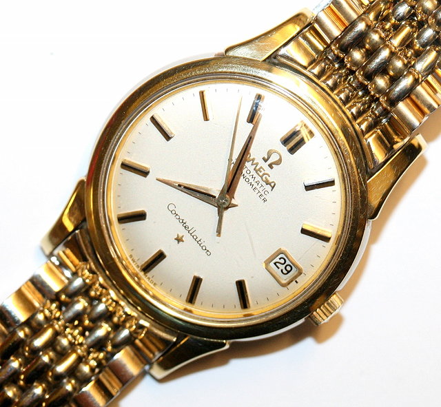 Appraisal: A GENTLEMANS GILT AND STAINLESS STEEL OMEGA AUTOMATIC CHRONOMETER CONSTELLATION