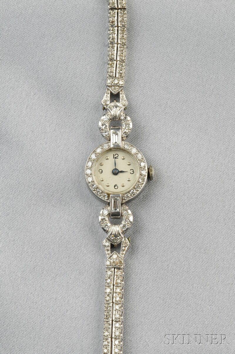 Appraisal: Platinum and Diamond Wristwatch the ivory-tone dial with Arabic and