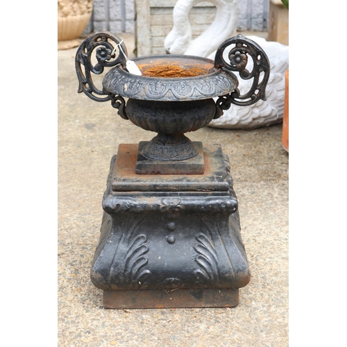 Appraisal: Black cast iron twin handled garden urn on plinth approx