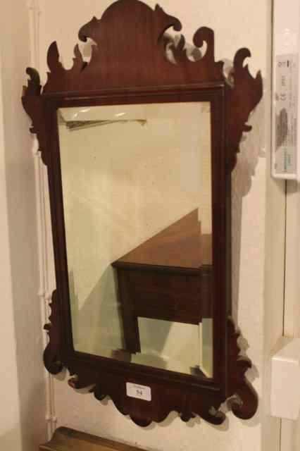 Appraisal: A GEORGE III MAHOGANY SMALL FRET WALL MIRROR with bevel