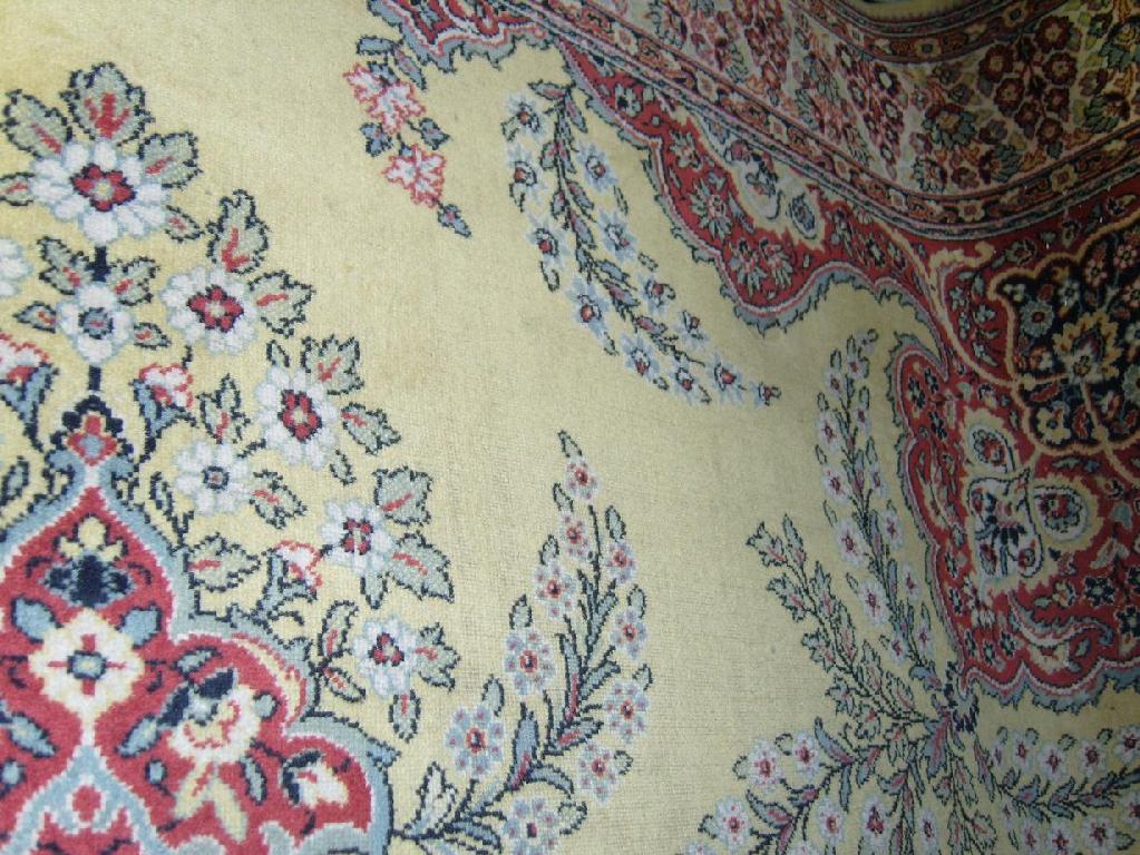 Appraisal: A large yellow ground carpet with Persian style floral decoration