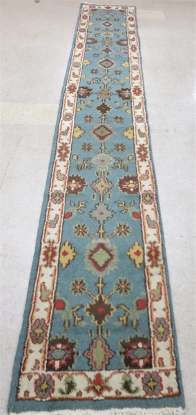 Appraisal: HAND KNOTTED ORIENTAL LONG RUG Indo-Persian runner stylized floral design