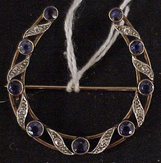 Appraisal: K yellow tested platinum tipped sapphire and diamond horseshoe pin