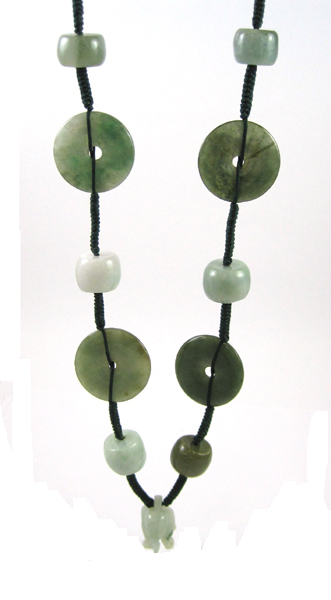 Appraisal: CHINESE GREEN HARDSTONE NECKLACE The adjustable green cord with eight