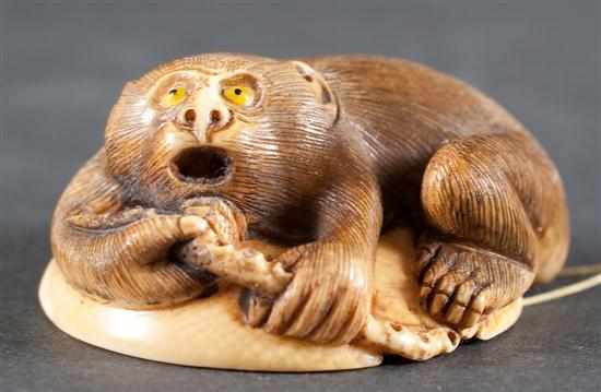 Appraisal: Japanese carved ivory netsuke Monkey finding an octopus under a