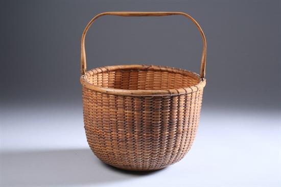 Appraisal: NANTUCKET SWING-HANDLE BASKET Bearing the label Made by Mitchell Ray