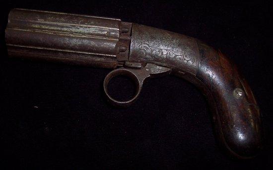 Appraisal: A pepper pot six chamber percussion cap revolver with compressed