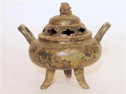 Appraisal: Chinese bronze and gilt inlaid covered tripod censer ming mark