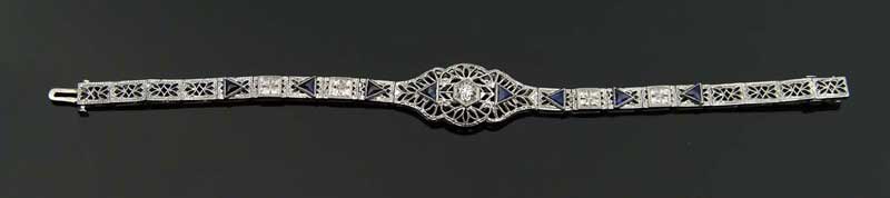 Appraisal: WHITE GOLD DIAMOND AND SYNTHETIC BLUE SAPPHIRE BRACELET Filigree bracelet