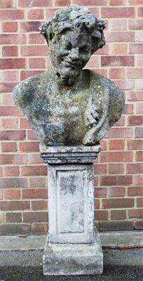 Appraisal: A reconstituted stone bust of Bacchus on a panelled rectangular