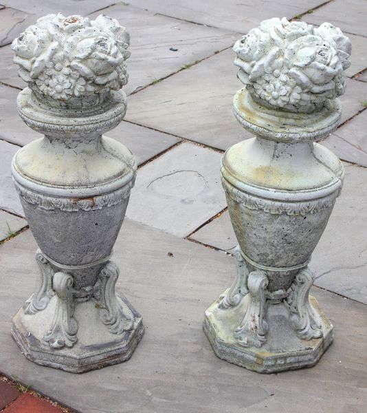 Appraisal: Pair of cement garden decorations with floral motif h Good