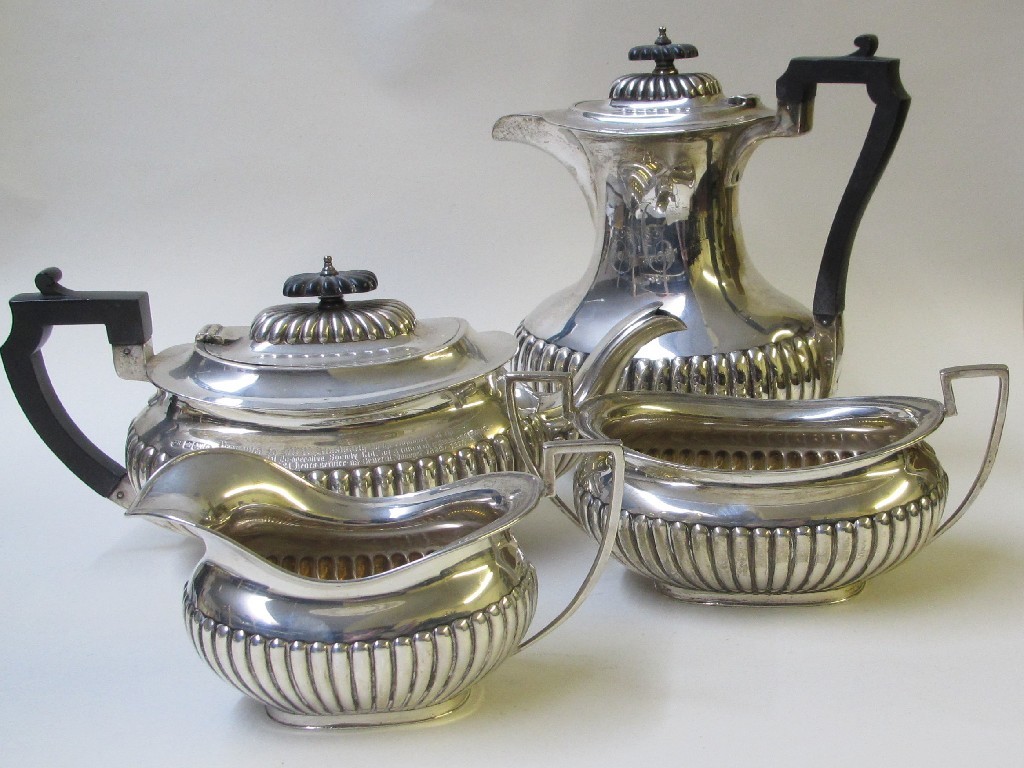 Appraisal: A silver four piece tea service embossed with lobed panels