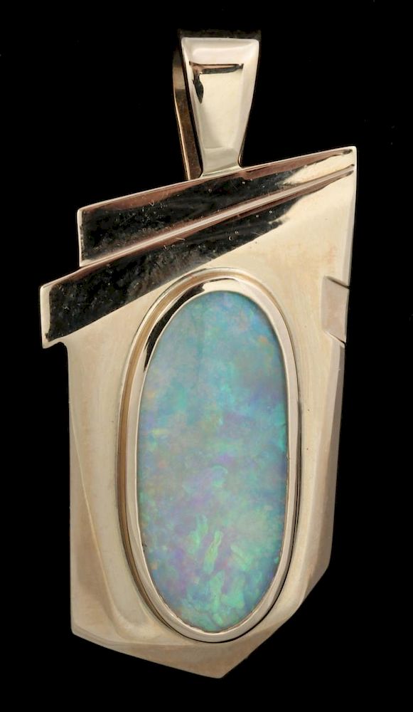 Appraisal: A K GOLD PENDANT WITH OPAL A k yellow gold