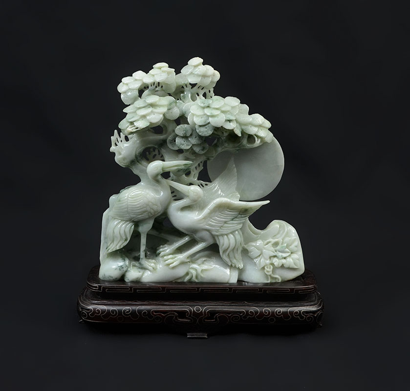 Appraisal: CHINESE CARVED JADEITE CRANES IN LANDSCAPE Apple green and white