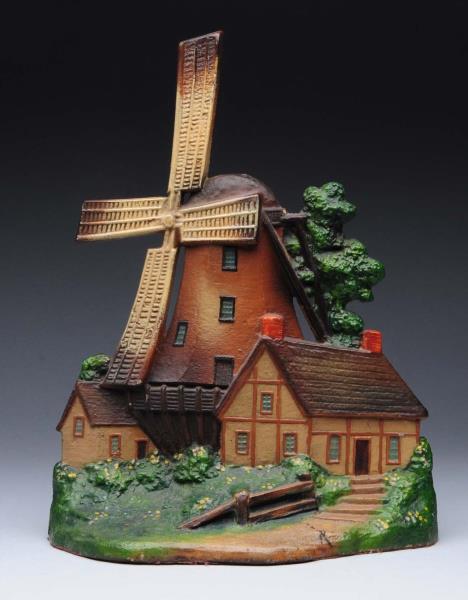 Appraisal: Cast Iron Windmill With Two Cottages Doorstop Signed numbered and