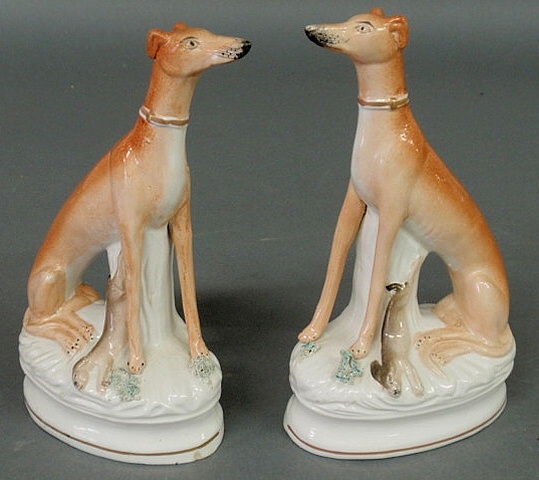 Appraisal: Pair of Staffordshire seated whippets with game c h x