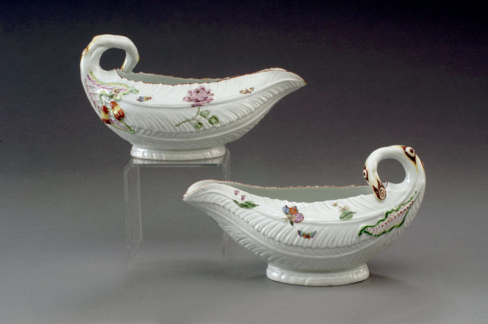 Appraisal: PAIR OF ASSEMBLED WORCESTER PORCELAIN COS LETTUCE LEAF SAUCEBOATS CIRCA