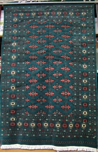 Appraisal: PAKISTANI BOKHARA CARPET hand knotted in a repeating Turkoman gol